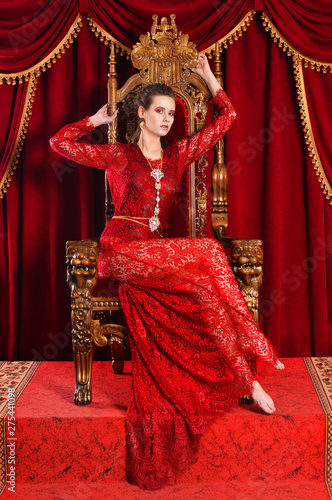 Portrait of young woman sitting on chair