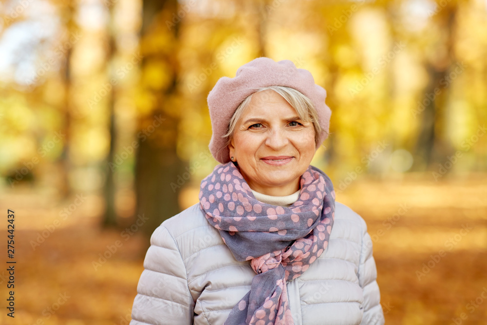 old age, retirement and season concept - portrait of happy senior woman at autumn park old age, retirement and season concept - portrait of happy senior woman at autumn park