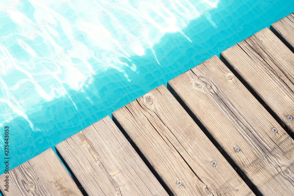 detailed view of a wooden floor and pool