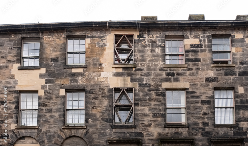 The Impressive architecture of Glasgows Past with ancient tenement stone work with re-enforced window lintels