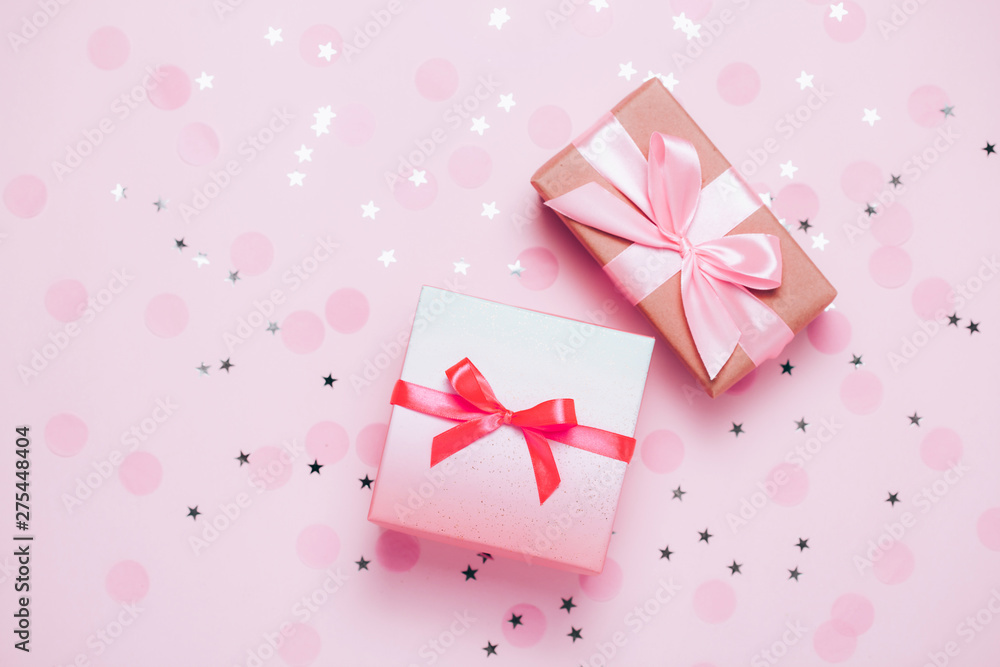 Pink present box on pink konfetti background. Pink present box on pink konfetti background.