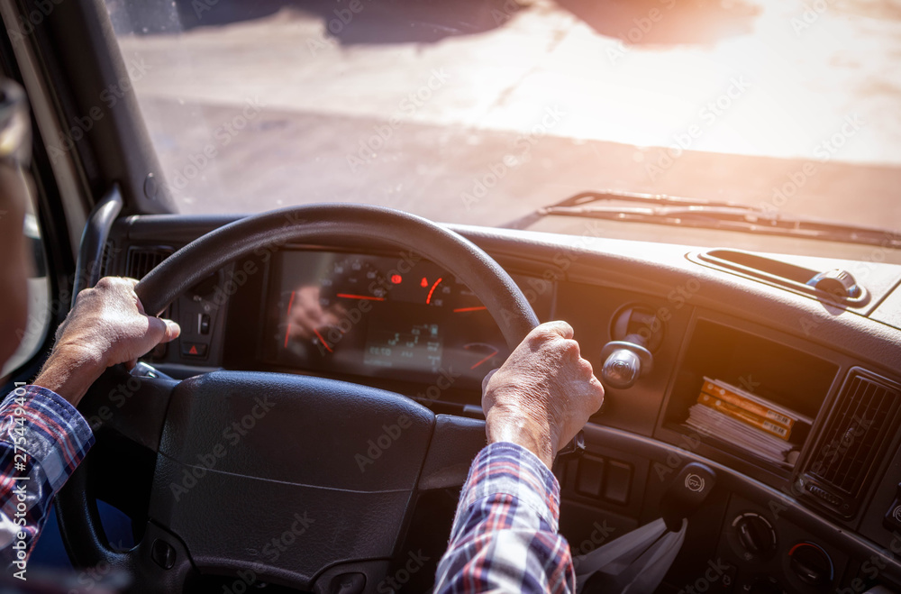Truck driver keeps driving with one hands and change gears,The man