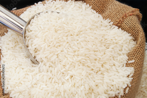 Rice with metallic scoop close up