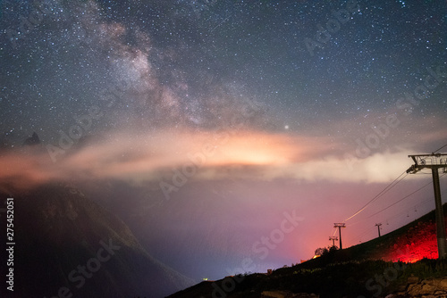 night sky with stars Milky Way over the mountains of the Caucasus with clouds