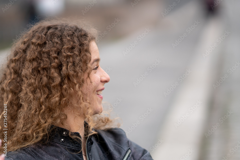 Young woman with curly hair Young woman with curly hair