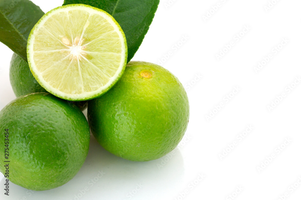 fresh green lime with whole and half with slice isolated on white background fresh green lime with whole and half with slice isolated on white background