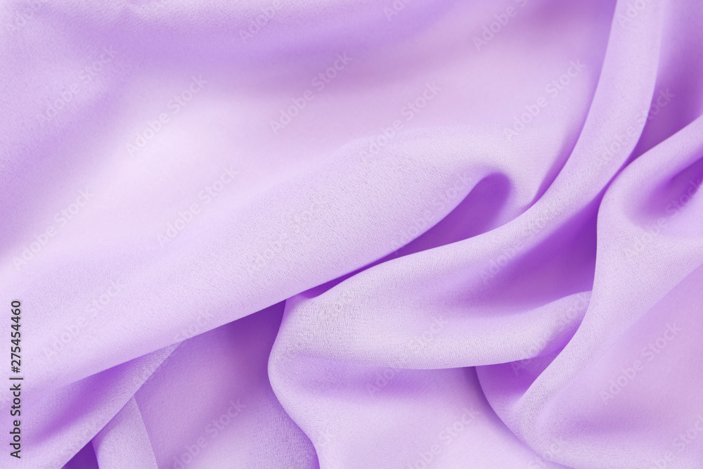 Obraz premium The texture of the satin fabric of lilac color for the background