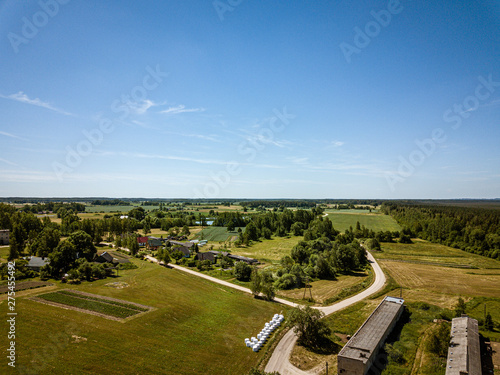 countryside roads and fields with small village. aerial view