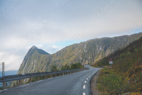 Narrow winding mountain road along the fjord. Senia Island, Norway, Europe