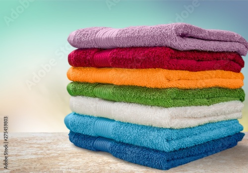 Fotografie Pile of  fluffy towels on background