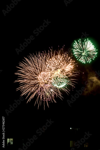 Vertical banner of beautiful sparks from fireworks in sky at night