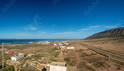 Morocco, North Africa [Moroccan landscape, rocky shore and seaside village, blooming flowres and surfing]