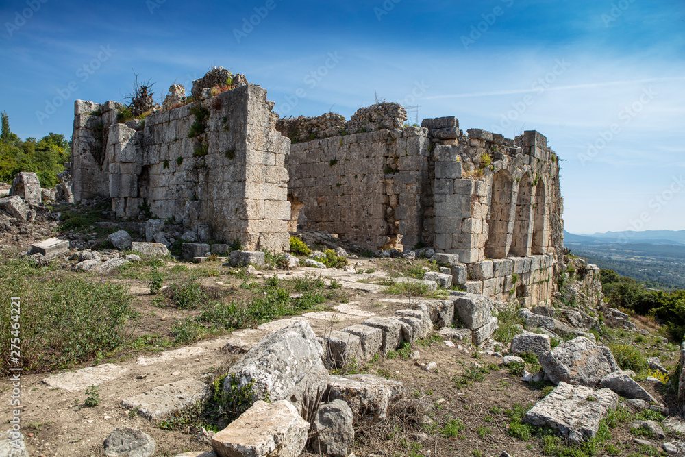 Tlos is an ancient ruined Lycian hilltop citadel near the resort town of Fethiye in the Mugla Province of southern Turkey Tlos is an ancient ruined Lycian hilltop citadel near the resort town of Fethiye in the Mugla Province of southern Turkey