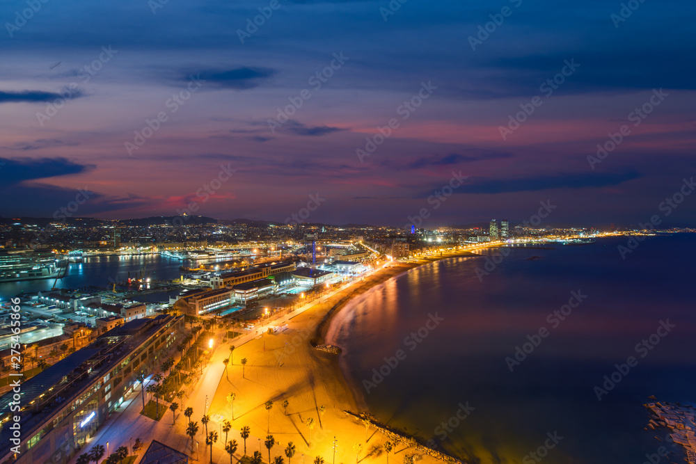 Aerial view of Barcelona Beach in summer night along seaside in Barcelona, Spain. Mediterranean Sea in Spain.