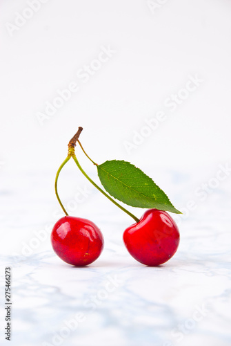 Fresh red cherries on the marble table. photo