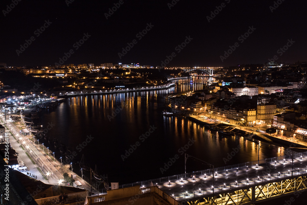 Panoramic view of the city of Porto and Vila Nova de Gaia at night with the river Douro and the bridge Dom Luis between the two cities, Porto, northern Portugal