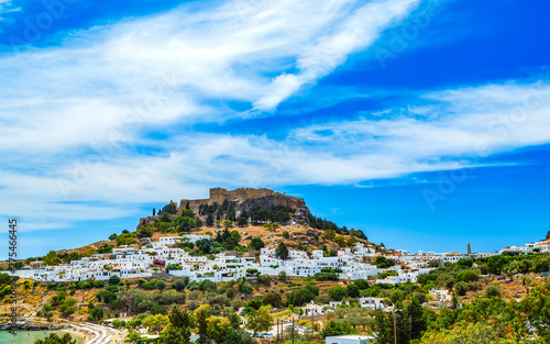Rhodes, Greece. Lindos small whitewashed village and Acropolis, scenery of Rhodos Island at Aegean Sea.