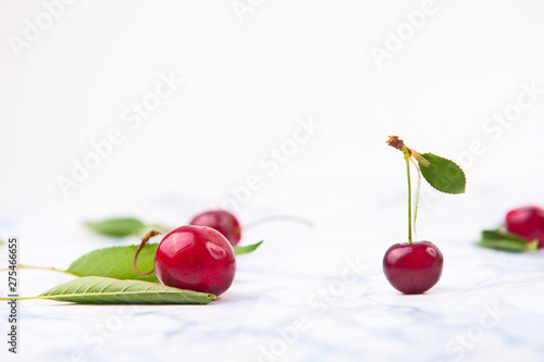 Fresh red cherries on the marble table. photo