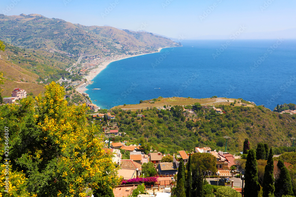 Beautiful landscape panorama of Sicily coastline. Blue Mediterranean sea and green mountians, Taormina, Sicily island, Italy.
