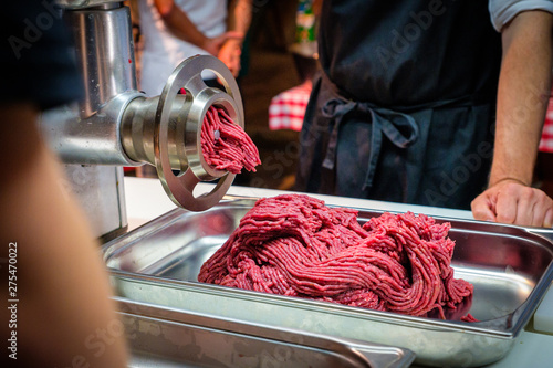 Hamburger meat freshly minced by a meat grinder photo