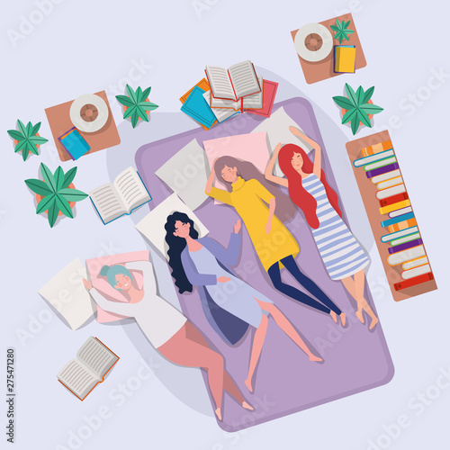 young women relaxing in mattress in the bedroom