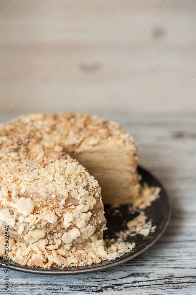 Slice Confectionery Napoleon Cake. Portion of Custard Cream Dessert copy space. Crumbs Around Plate. Bakery Tasty Sweet Dish Closeup Slice Confectionery Napoleon Cake. Portion of Custard Cream Dessert copy space. Crumbs Around Plate. Bakery Tasty Sweet Dish Closeup