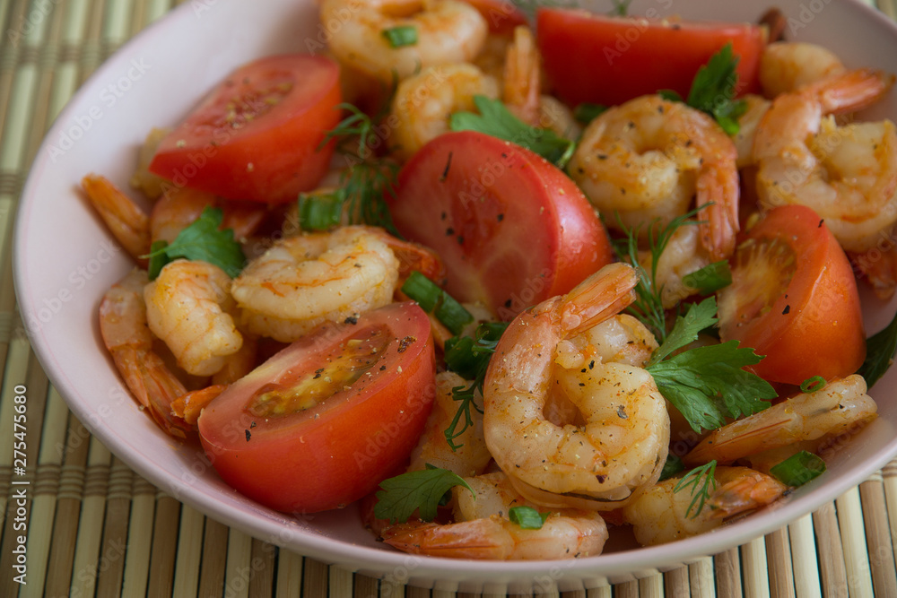 Salad with Royal prawns, red tomatoes, dill, parsley and green onions Salad with Royal prawns, red tomatoes, dill, parsley and green onions