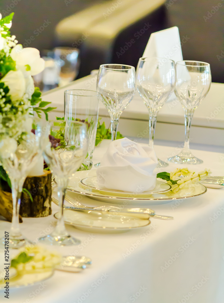 Luxury party dinner table setting with tableware and silverware and glasses set and Candlestick and flower in restaurant. Luxury party dinner table setting with tableware and silverware and glasses set and Candlestick and flower in restaurant.