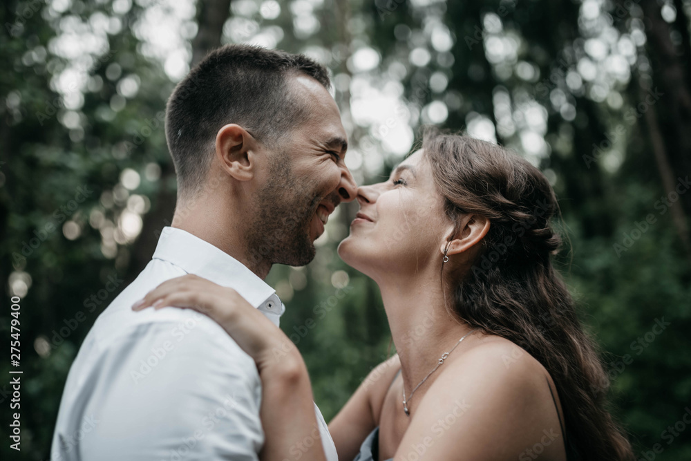 Loving couple in the woods on a romantic date at engagement. The young family is happy in harmony. Loving couple in the woods on a romantic date at engagement. The young family is happy in harmony.