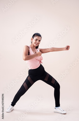 The young woman wearing sportwear, posing Zumba dance workout,basic pattern,for exercise,with smile and happy feeling