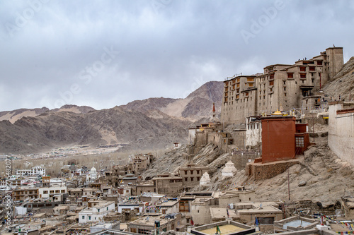 Leh Ladakh city view from Leh Palace. Beautiful amazing village in the valley with snow mountain at background. Ladakh, India. © chayakorn