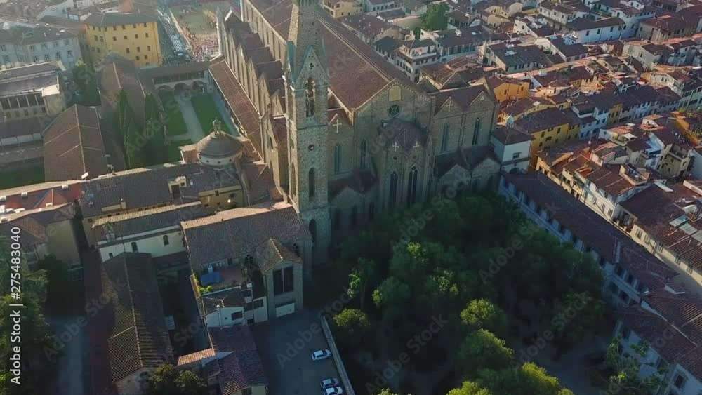 Aerial, tilt up, drone shot passing the Basilica di Santa Croce, towards the Santa Maria del Fiore cathedral and the Palacio Vecchio, in middle of Florence city, on a sunny evening, in Toscany, Italy Aerial, tilt up, drone shot passing the Basilica di Santa Croce, towards the Santa Maria del Fiore cathedral and the Palacio Vecchio, in middle of Florence city, on a sunny evening, in Toscany, Italy
