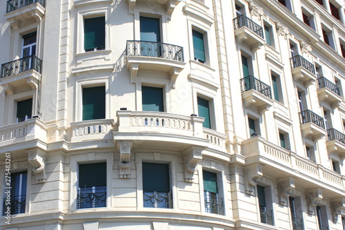 Traditional facade of European architecture with windows and balconies