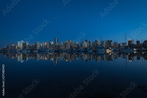 Skyline of Downtown Vancouver mirrored in Pacific Ocean. © Ivan