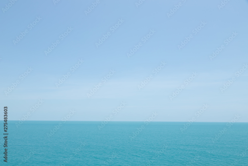 Sea waves in ocean wave splashing thinly ripple water. Blue water and sky background. Sea waves in ocean wave splashing thinly ripple water. Blue water and sky background.