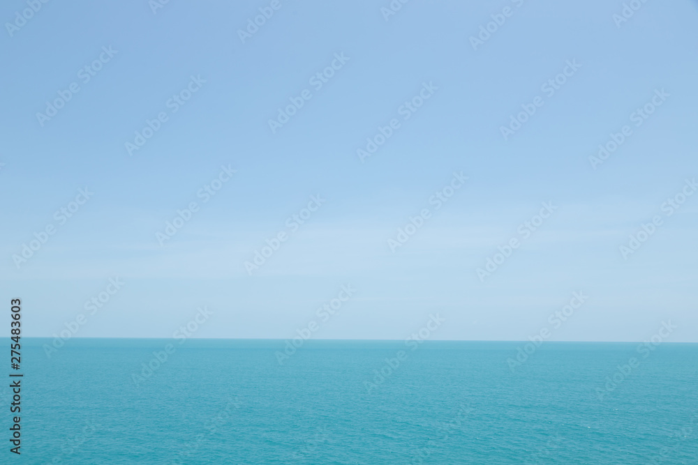 Sea waves in ocean wave splashing thinly ripple water. Blue water and sky background.