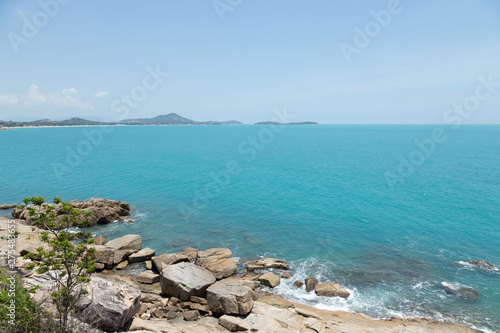 view of sea waves shore and fantastic rocky beach coast on the island and background sky with mountain  Wild nature. Tropical landscape coastline. Summertime. Travel holiday concept.