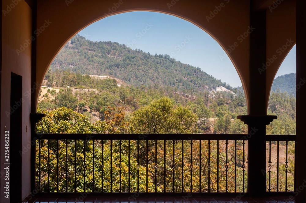 Fototapeta premium A view trough an arch of the mountains
