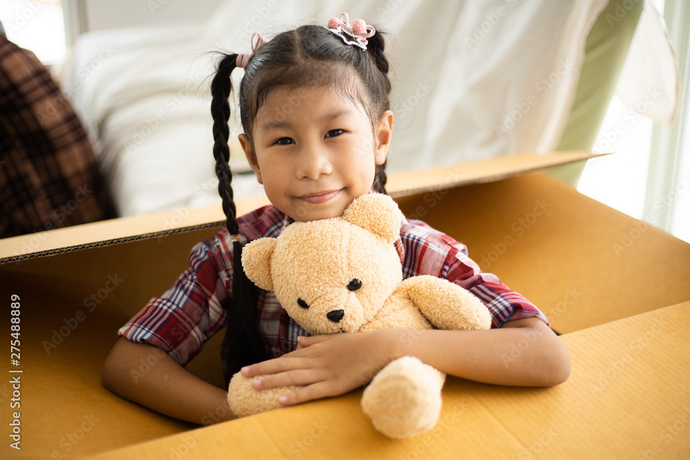 Portrait of Little Asian girl smile and happy mood in white living room Portrait of Little Asian girl smile and happy mood in white living room