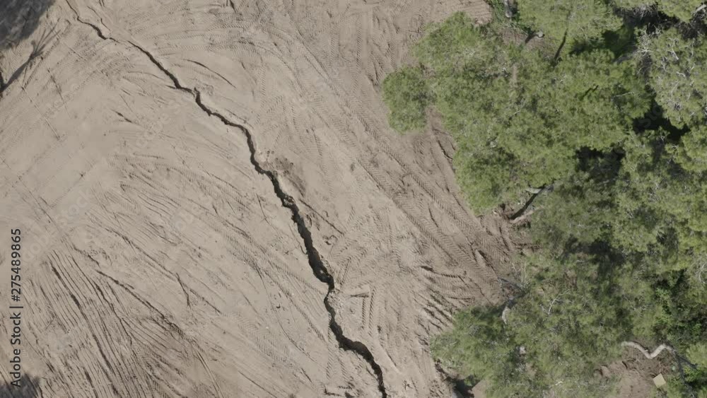 Aerial view of a huge earth crack in dry desert soil in Israel Aerial view of a huge earth crack in dry desert soil in Israel