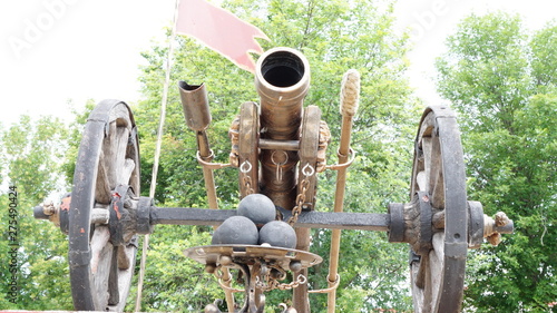 Reconstructed Bronze gun on a wooden carriage with cast-iron cores photo