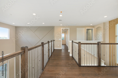 Large second story walk way with railing