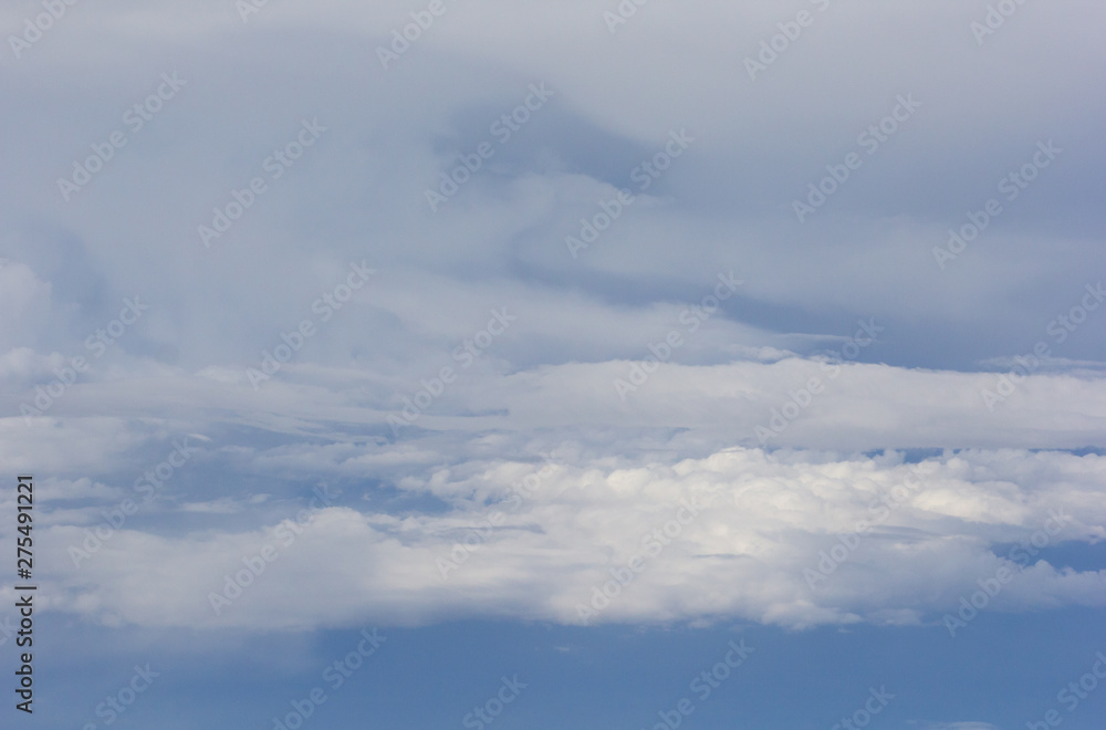 Obraz premium Flying through blue sky with clouds