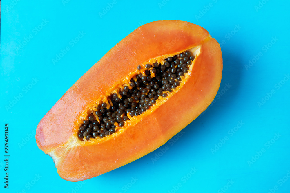 Half of tasty papaya with seeds Half of tasty papaya with seeds