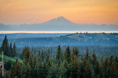 Mt. Redoubt volcano on sunset sky background, Alaska