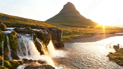 Famous Kirkjufell mountain with cascade waterfalls, Iceland. Kirkjufell is one of the most beautiful natural heritage of Iceland photo