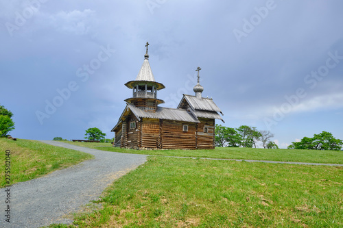 Scenic view of small wooden orthodox church on Kizhi island on Onezhsky lake in Russian Federation. Beautiful summer sunny look of traditional temple of russian North in Karelia