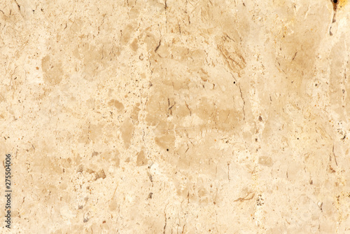 Golden marble texture of a natural white and golden stone tile.