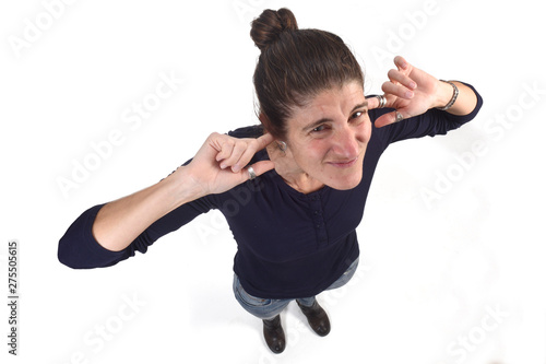 woman making noise hurting her ears on white background