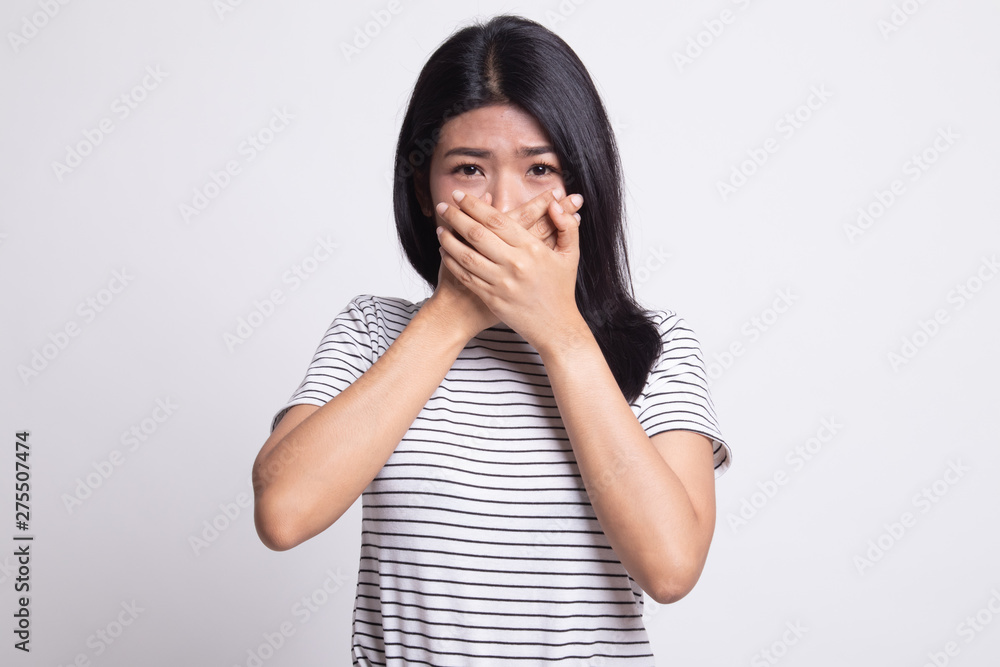 Beautiful young Asian woman close her mouth. Beautiful young Asian woman close her mouth.
